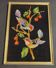 Vintage tapestry framed birds on black background