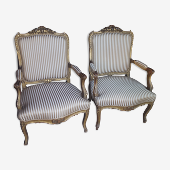 Pair of Louis XV armchairs in gilded wood