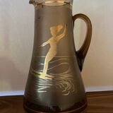 Vintage smoked glass carafe with gold from the 50s/60s, featuring a marine and water skiing design.