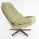 Chauffeuse pivotante scandinave verte