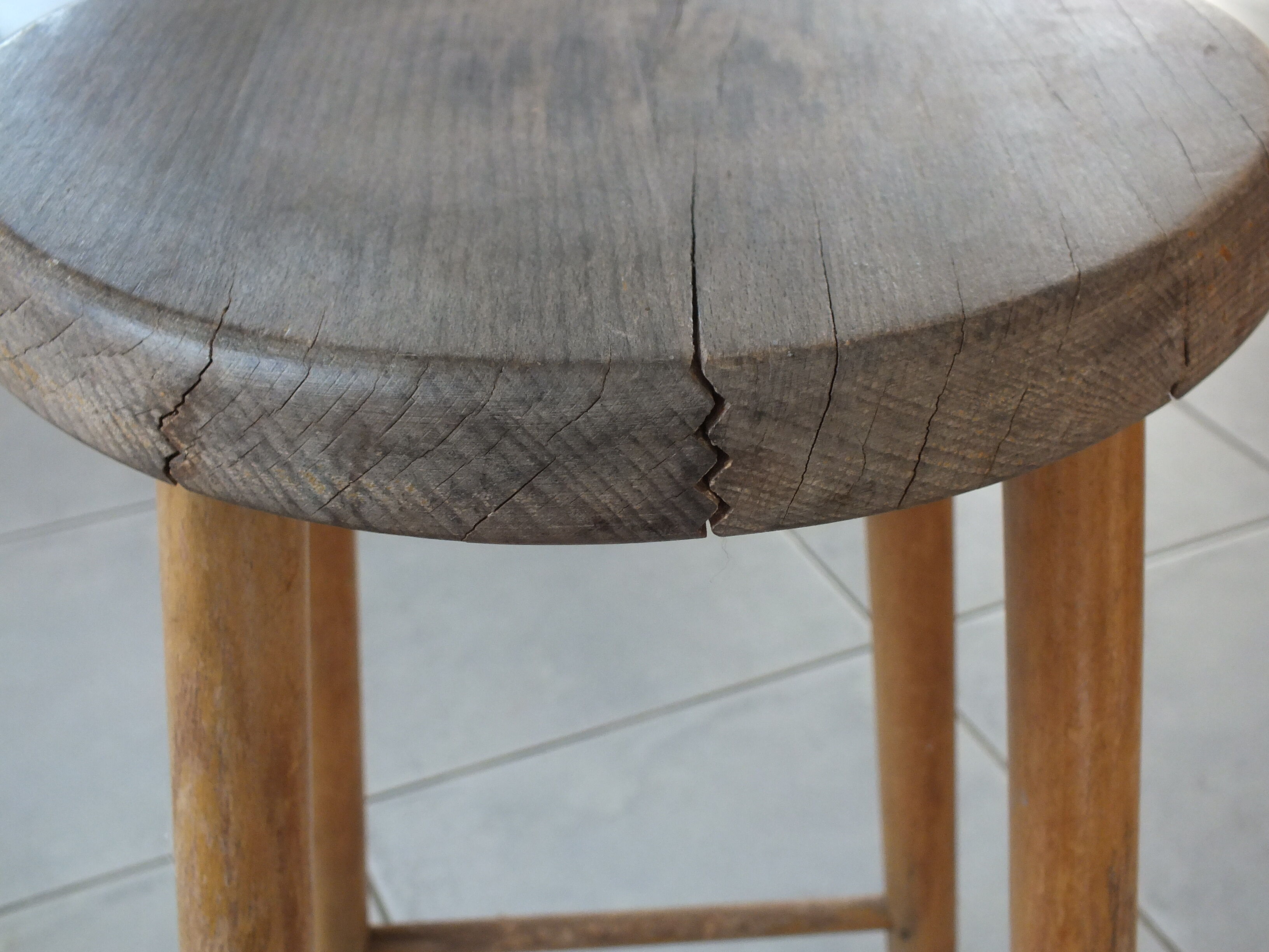 Vintage stool in patinated natural wood
