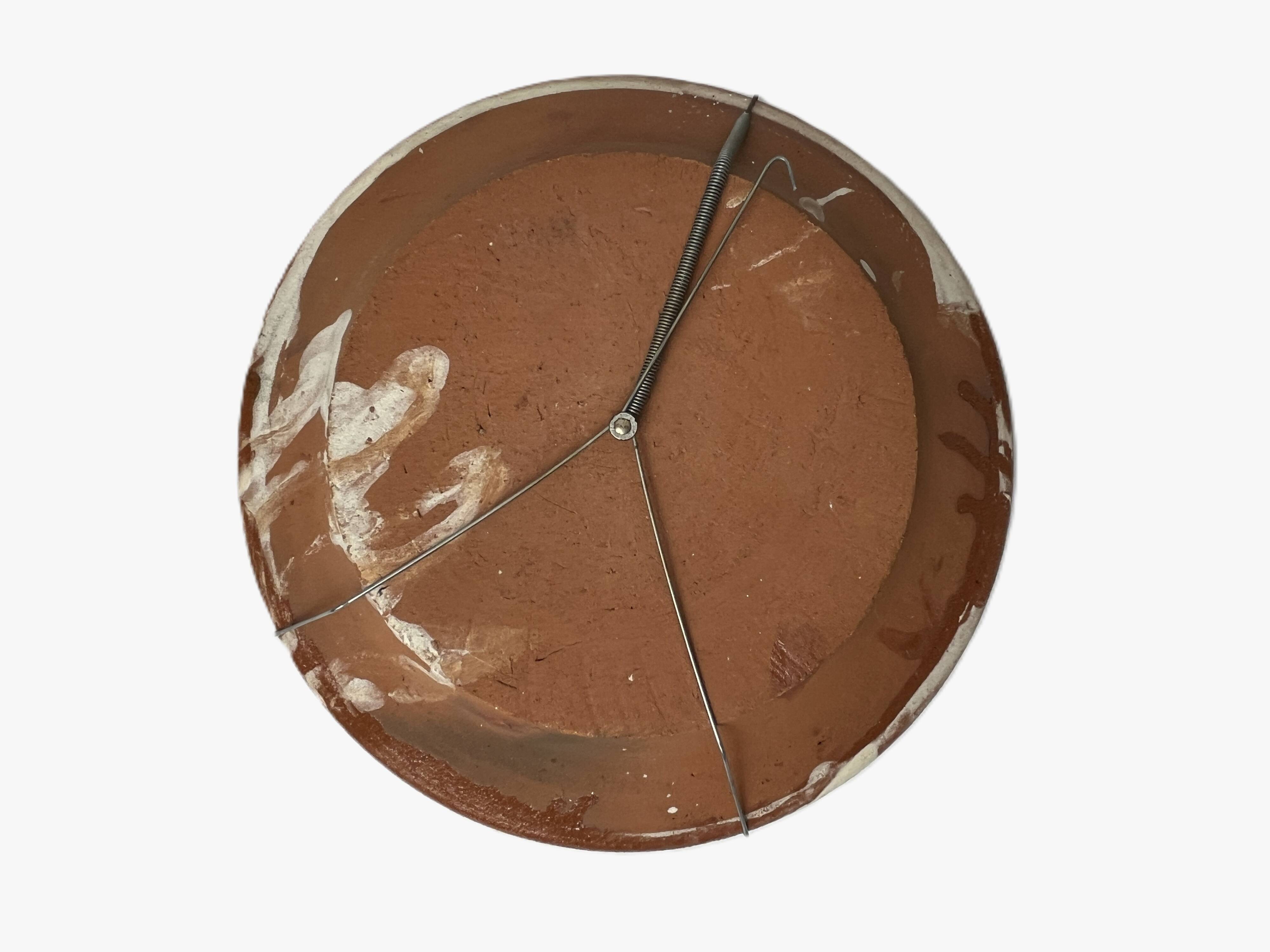 Old terracotta plate decorated with chickens, Portugal, 20th century.