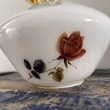 Golden tilting wall light with flowered globe