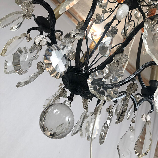 Black lacquered metal chandelier and crystal tassels