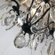 Black lacquered metal chandelier and crystal tassels