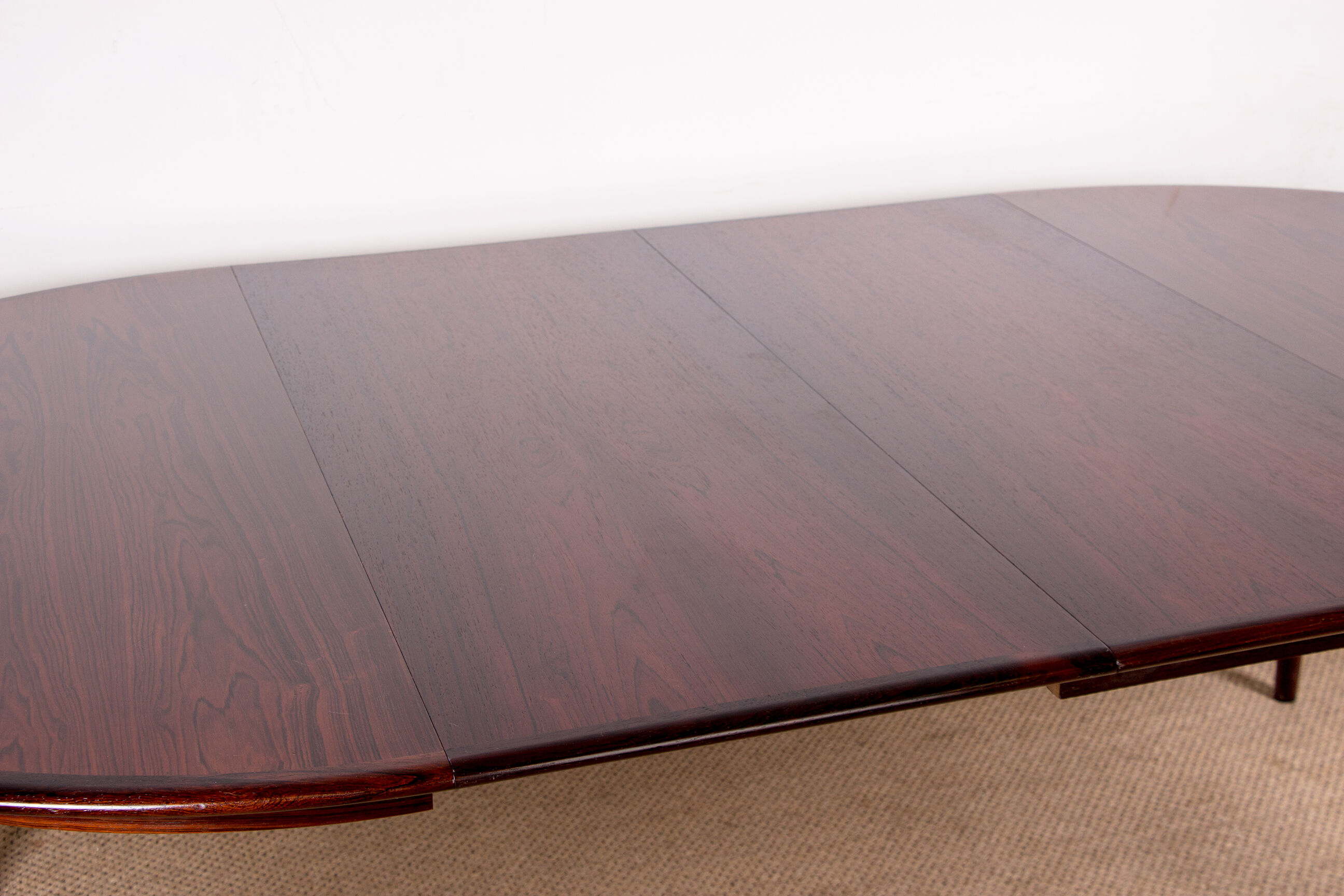 Danish extendable dining table in Rio Rosewood model 55 by Arne Vodder for Sibast 1958.