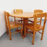 Suite of a round table with extension and 4 vintage pine chairs from the 60s and 70s