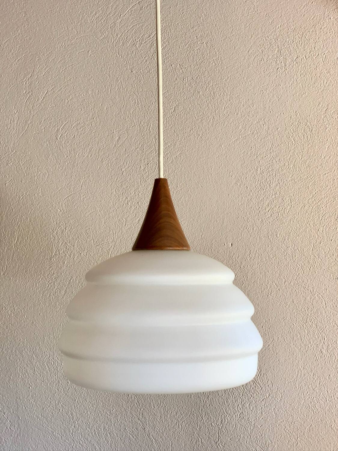 Scandinavian teak and opaline pendant light by Louis Kalff for Philips in 1968