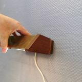 Fuga wall lamp in solid brass and teak wood was designed by Jo Hammerborg for Fog & Mørup in 1966.