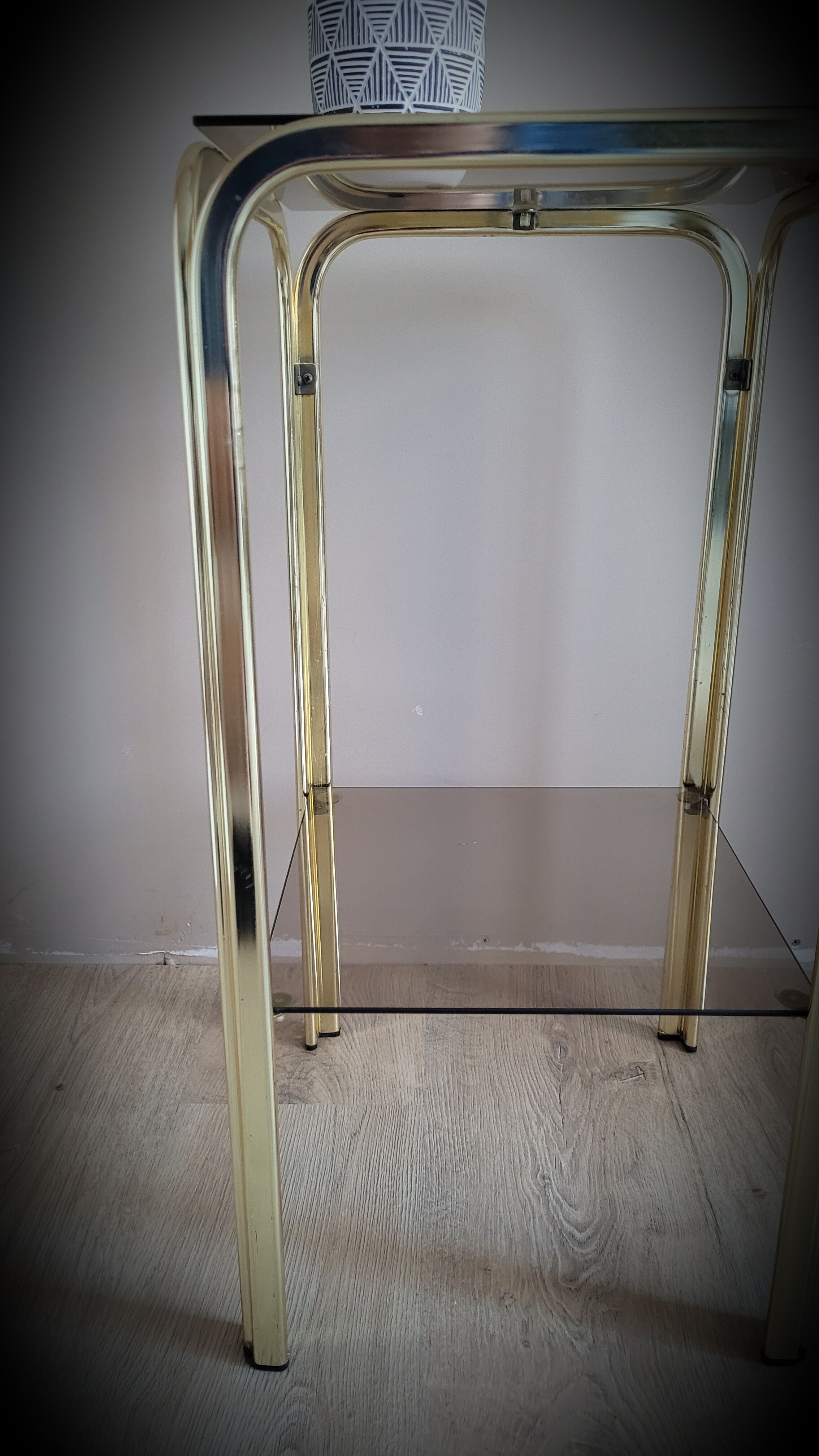 Golden side table and smoked glass