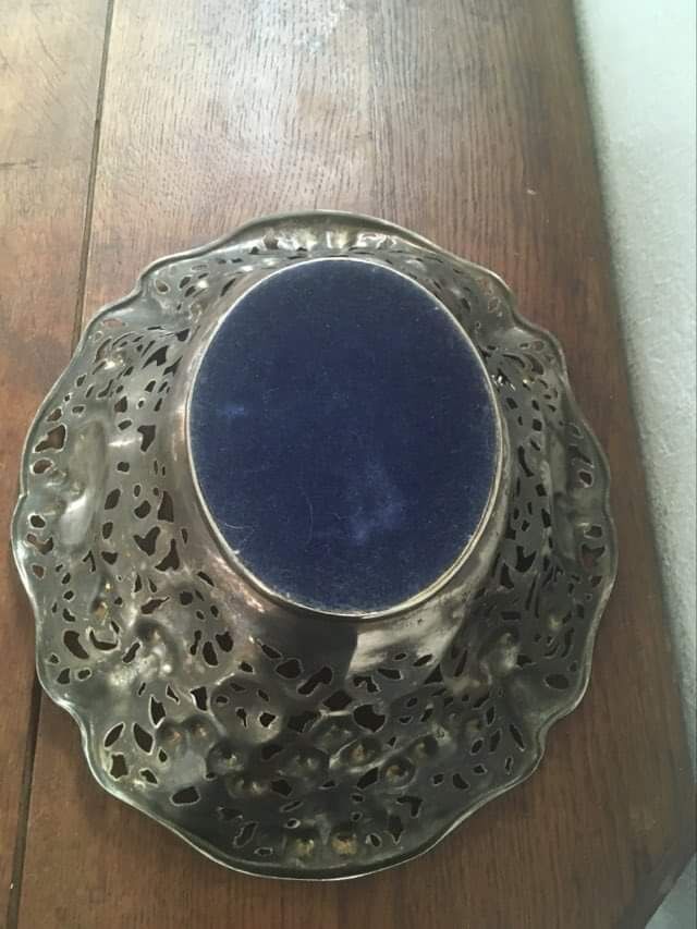 Silver metal basket with floral decoration