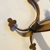 Pair of gilded metal sconces decorated with clovers.