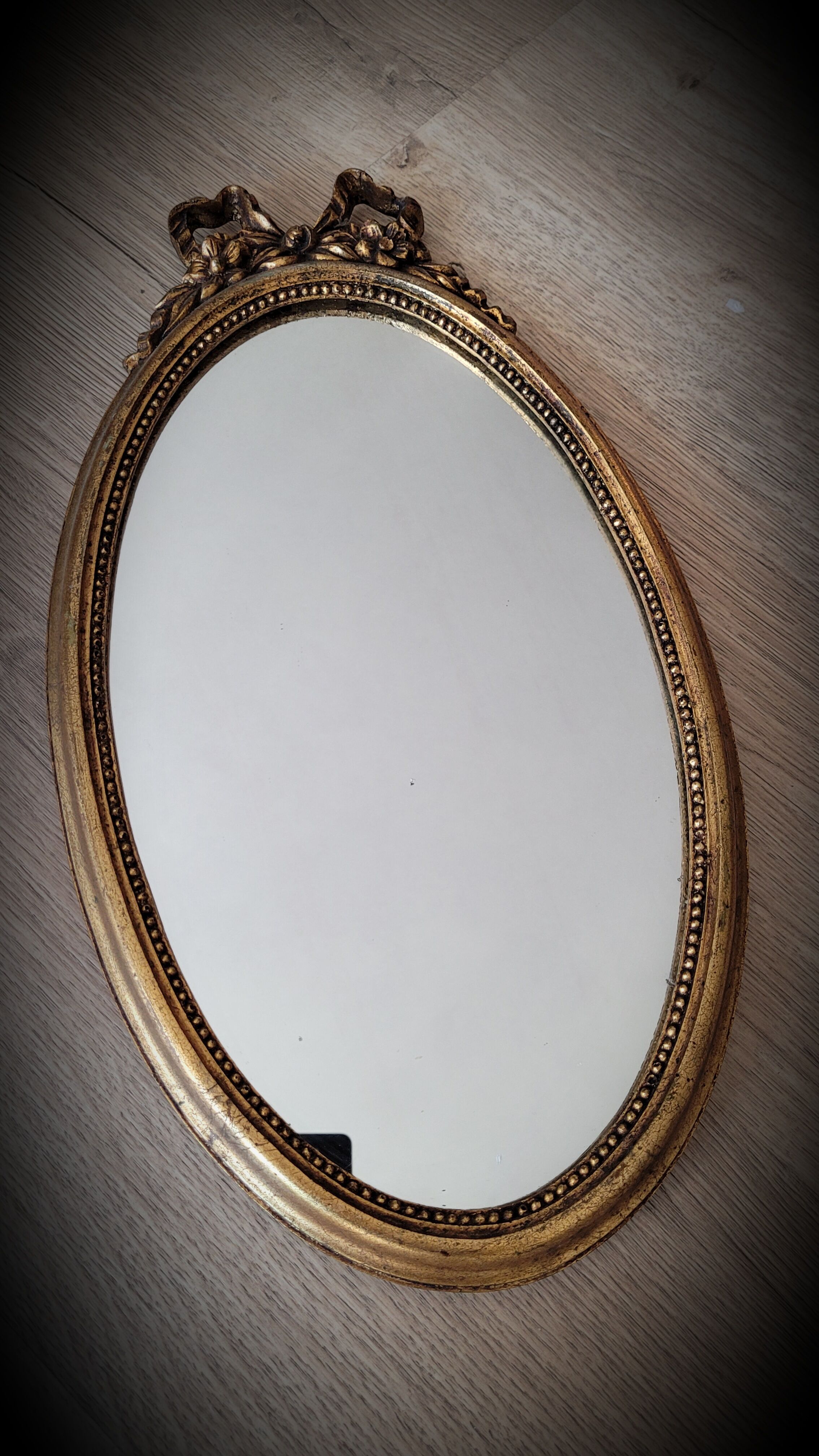 Oval golden mirror 41x23