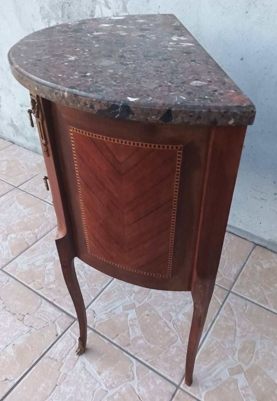 Half-moon commode in Louis XV style with walnut veneer.