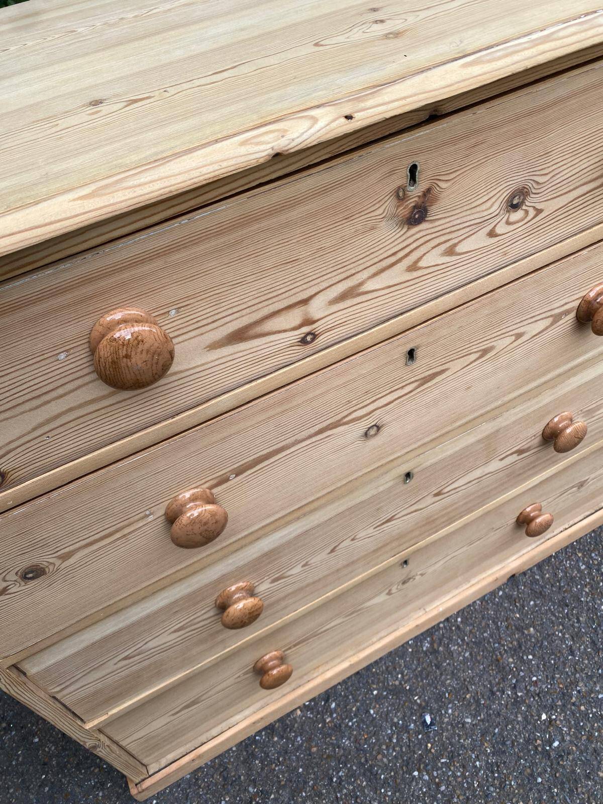 Victorian commode from the 19th century stripped to raw solid wood with ceramic knobs.