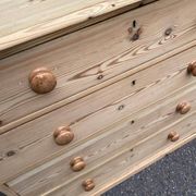 Victorian commode from the 19th century stripped to raw solid wood with ceramic knobs.
