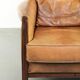 Cognac-coloured Art Deco design armchair made of sheepskin with a high back