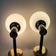 Pair of wall lights in gilded and black lacquered brass, Italy 1970/1980.