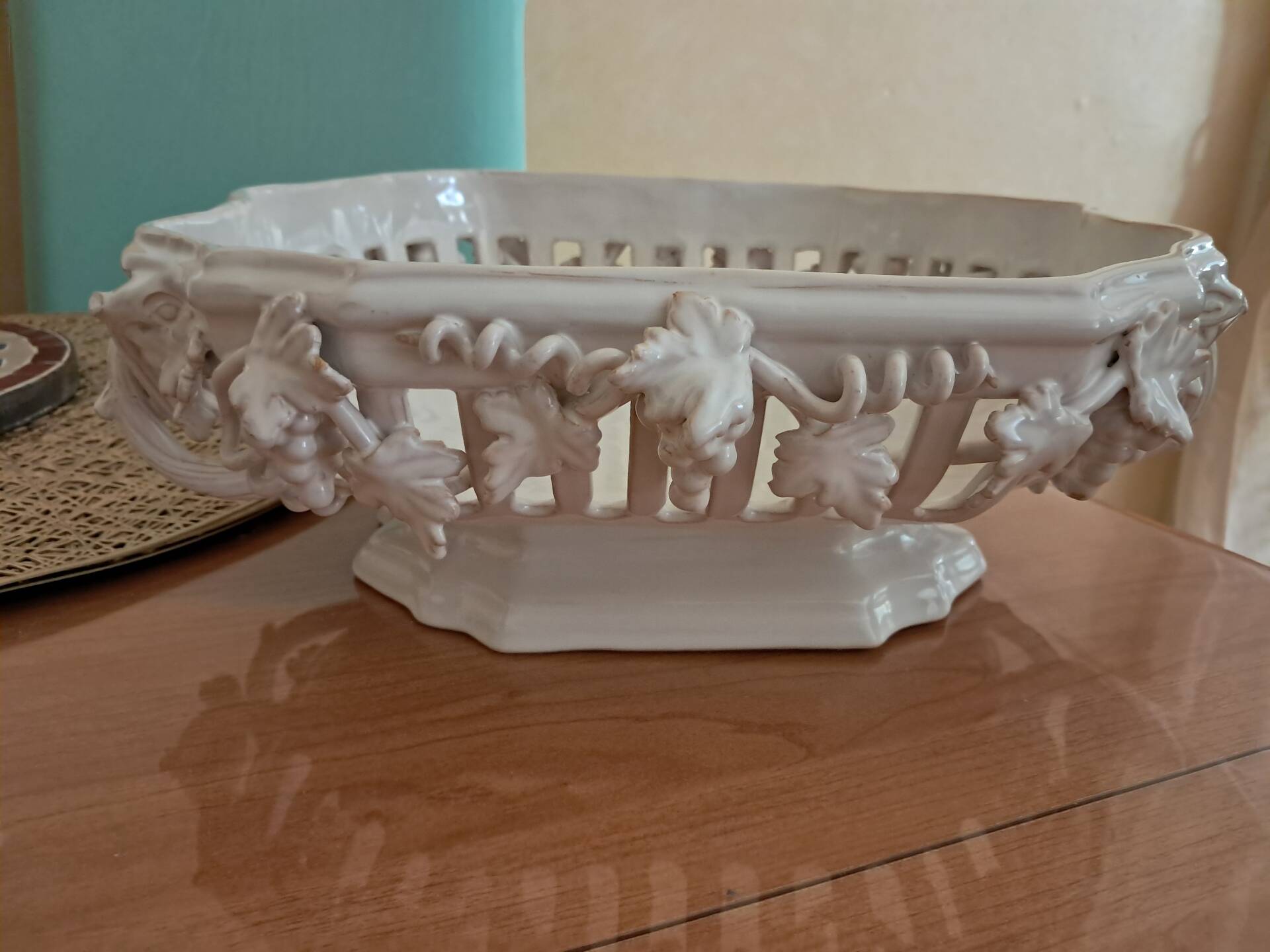 Malicorne fruit bowl in white pierced faience with monogram TE.
