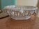 Malicorne fruit bowl in white pierced faience with monogram TE.