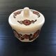 Beige butter dish with floral decoration