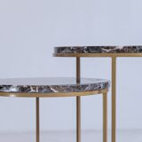 Trundle tables in imperial brown marble.
