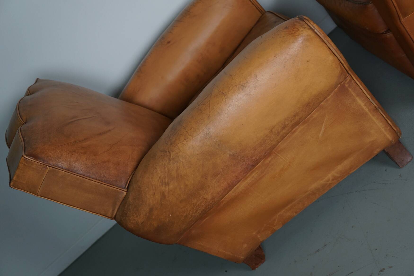 Pair of French Cognac Moustache Back Leather Club Chairs, 1950s