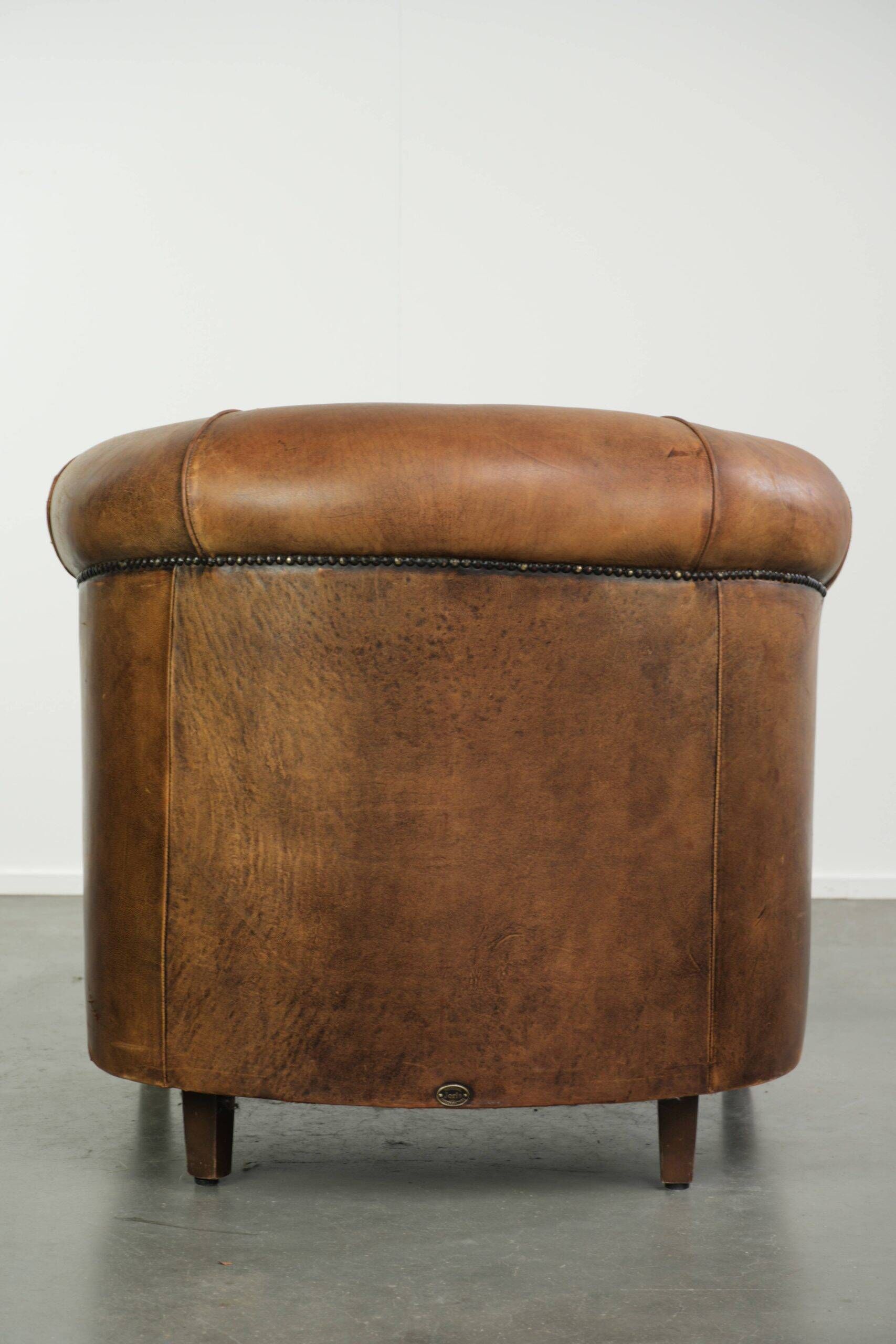 Vintage sheepskin clubchair in a beautiful cognac colour with a sturdy look