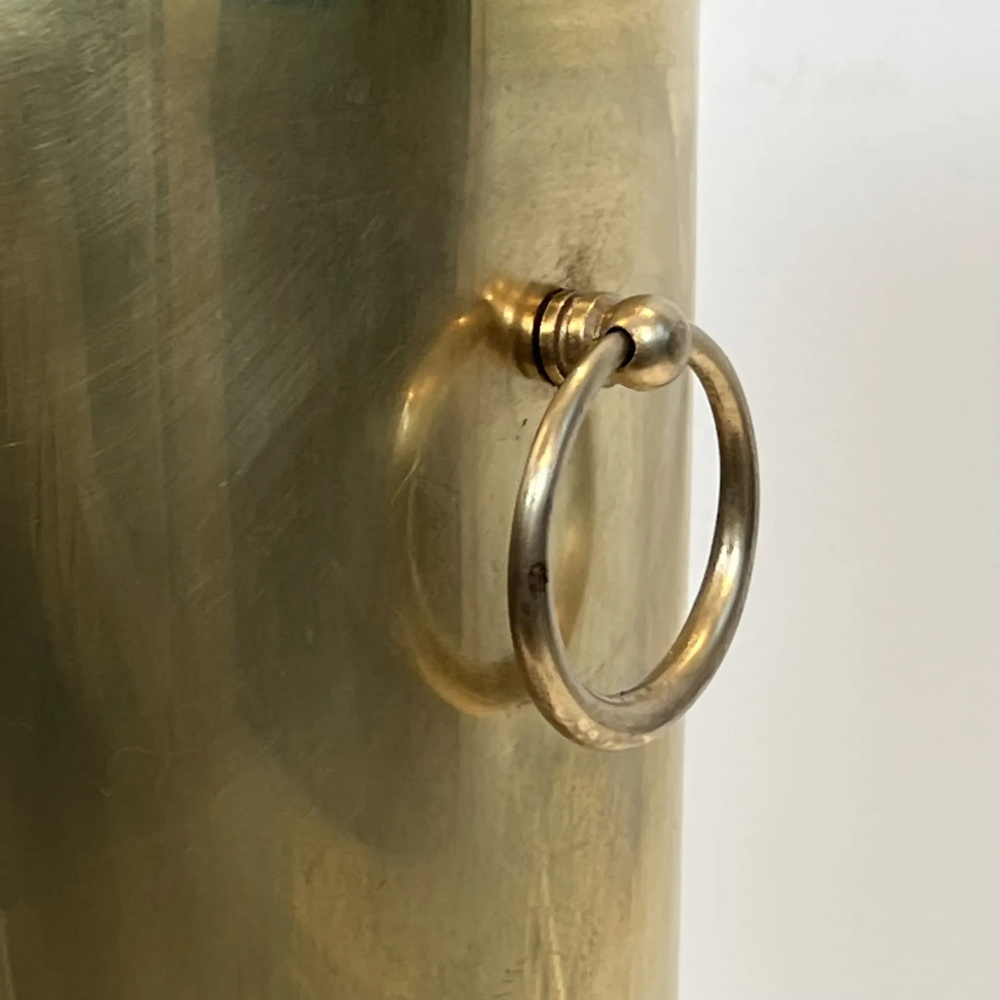 Cylindrical Brass Umbrella Stand with Ring Handles and Claw Feet.
