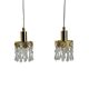 Two gold-plated brass and crystal pendant lights, by Palwa, 1960s design, Hollywood Regency.