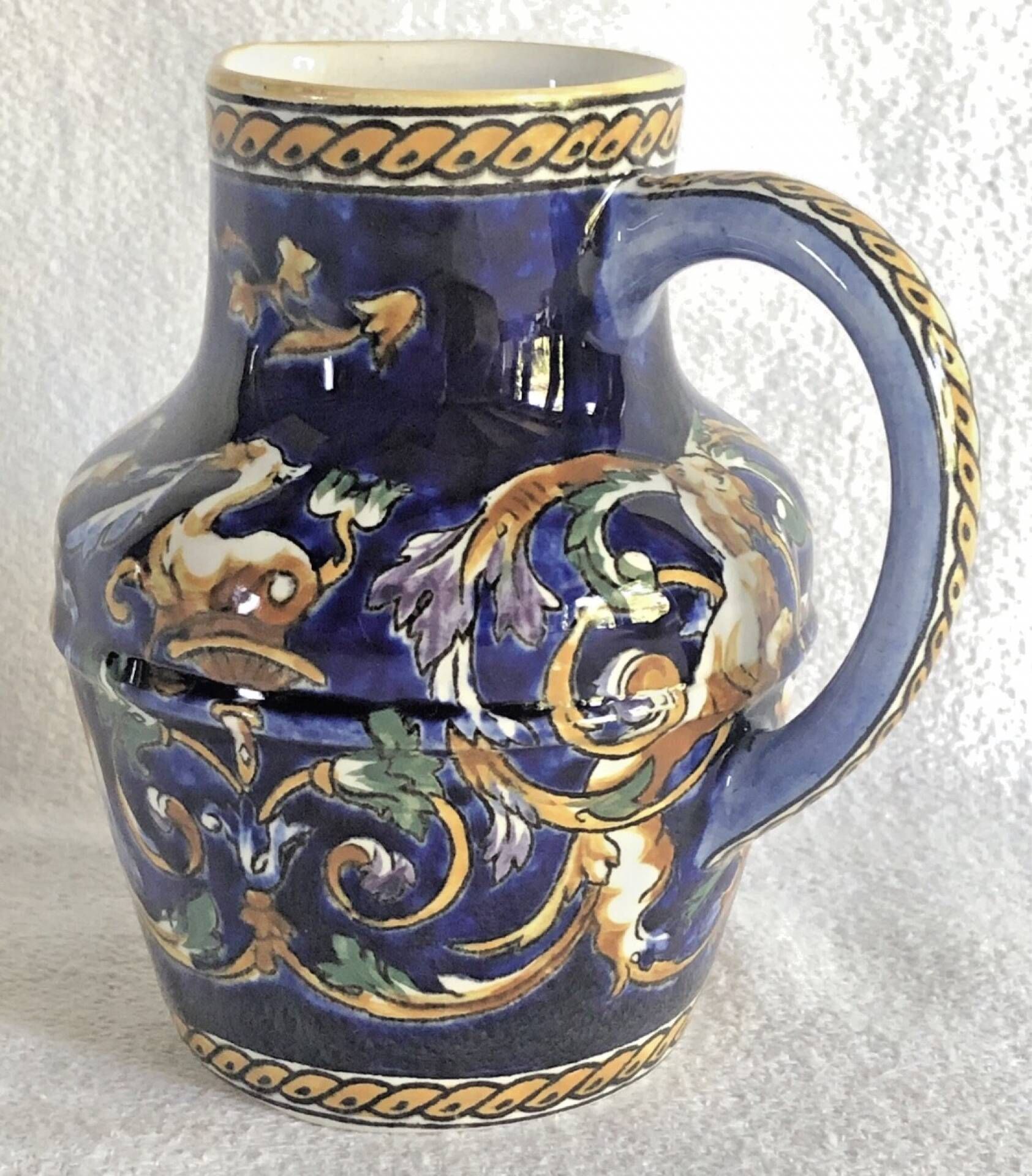 Old cream jug Gien Renaissance blue background 1938/1960