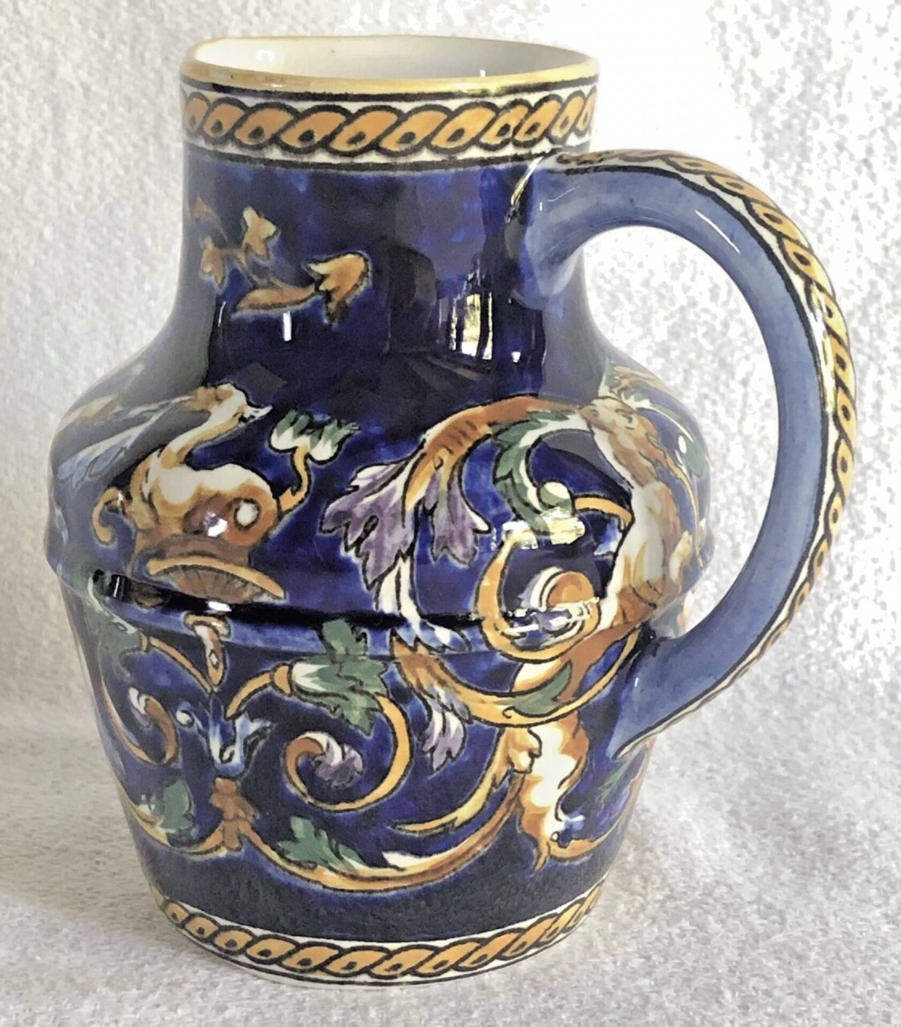 Old cream jug Gien Renaissance blue background 1938/1960