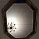 Miroir octogonal en bois doré biseauté  92x71cm