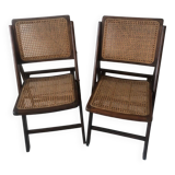 Pair of folding chairs in cane and dark wood