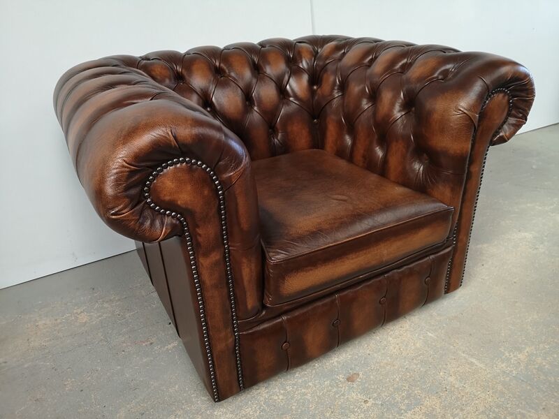 Brown leather chesterfield armchair