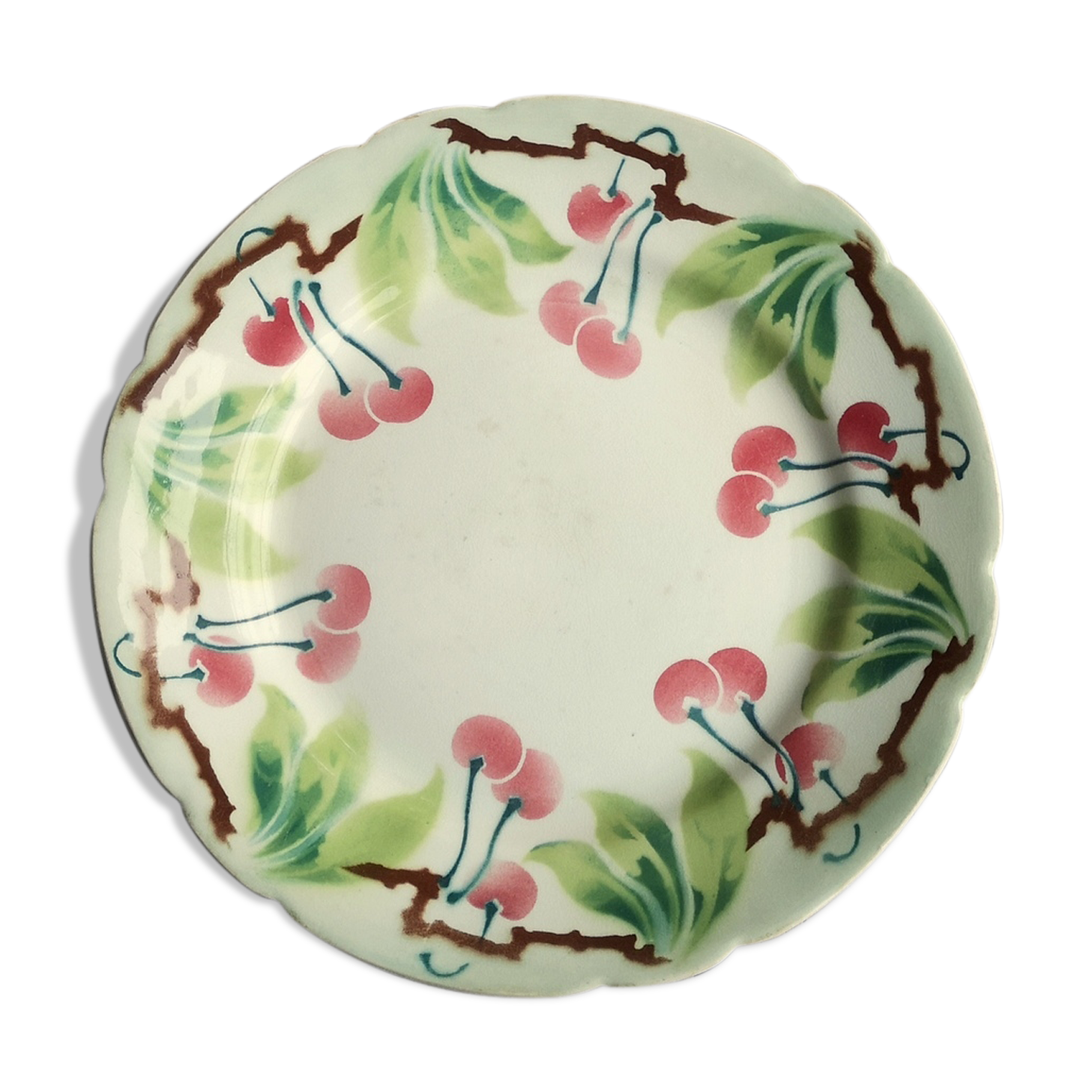 Old decorative plate in barbotine by luneville cherry motif