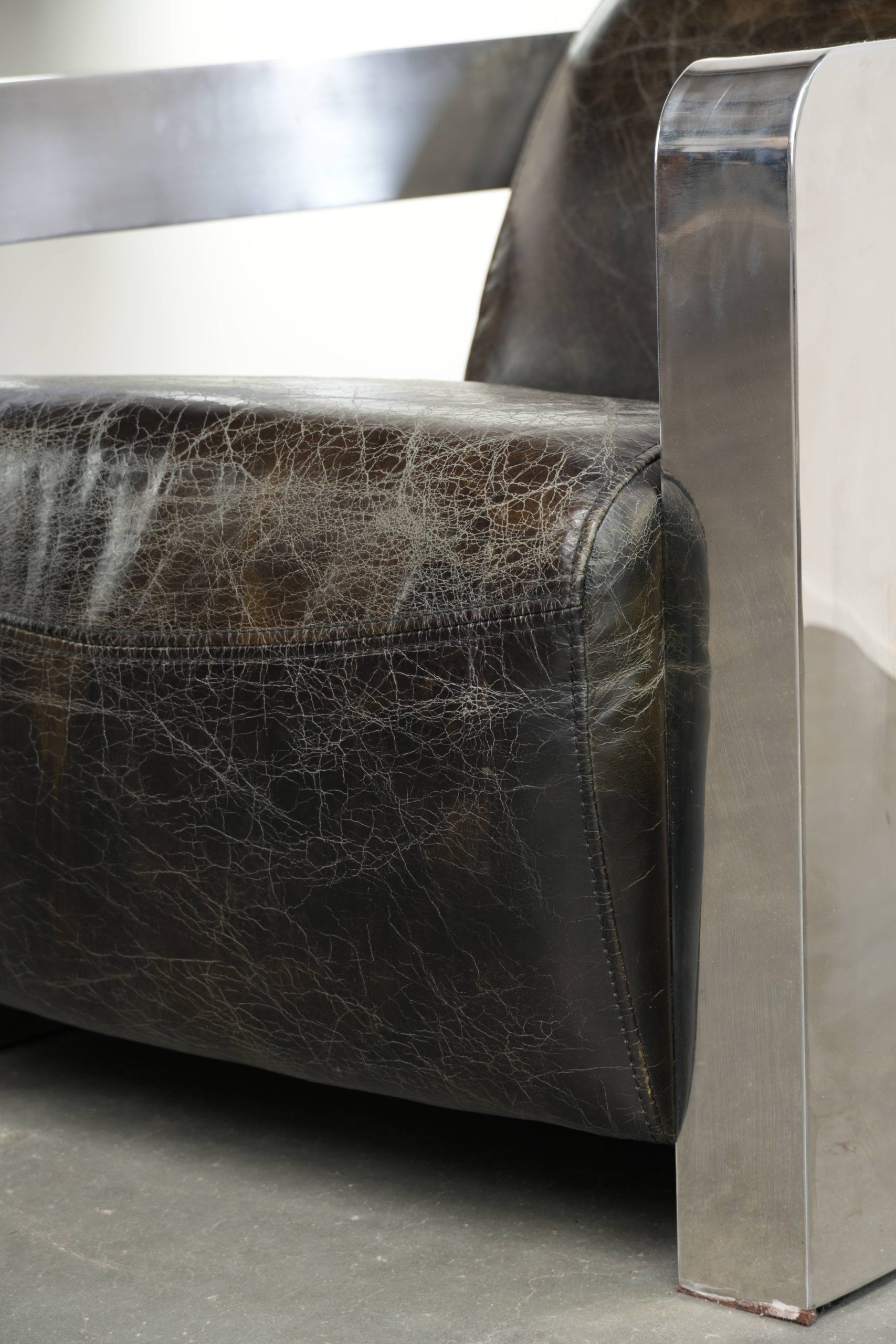 Industrial Aviator design armchair in cowhide finished with aluminium