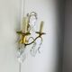 Bronze wall light with rococo style Louis XV pendants.