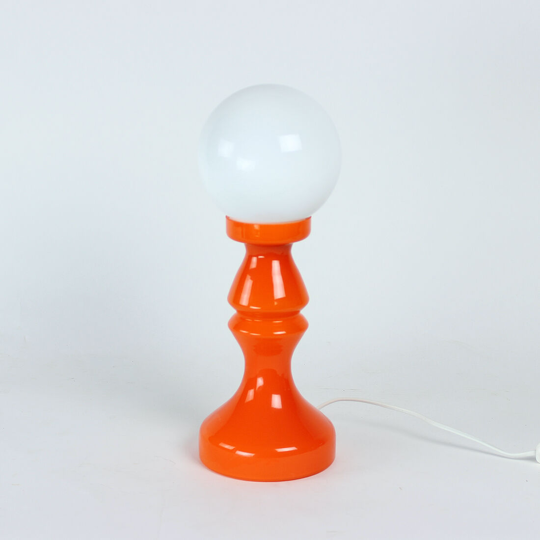 Orange glass table lamp by vitropol, poland 1960s