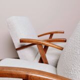 Vintage armchair in pearl white bouclé with walnut wood, 1960.