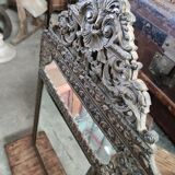 Mirror with embossed brass bead