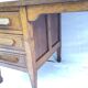 Wooden desk with three drawers
