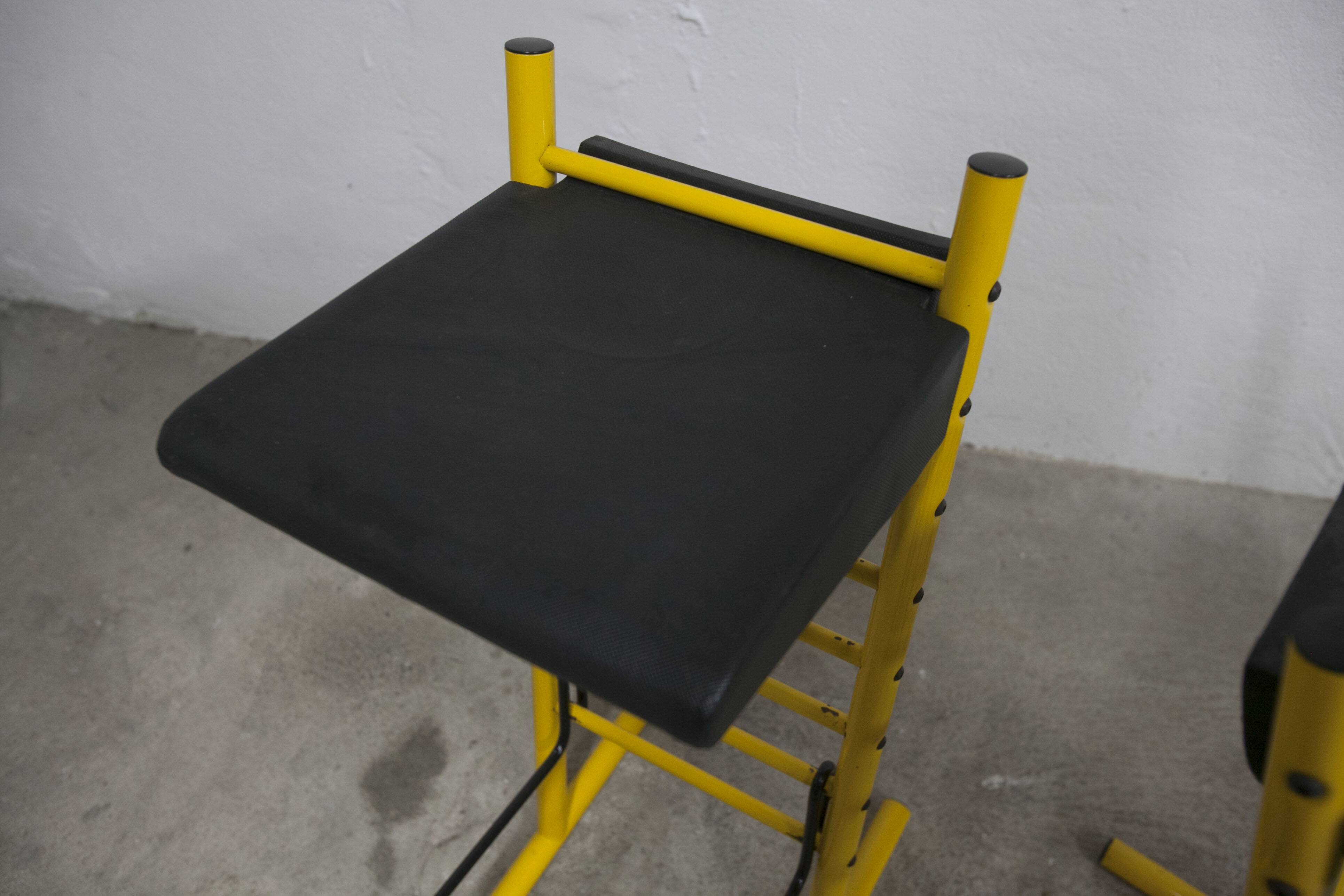 Pair of adjustable Italian bar stools in lacquered yellow and black