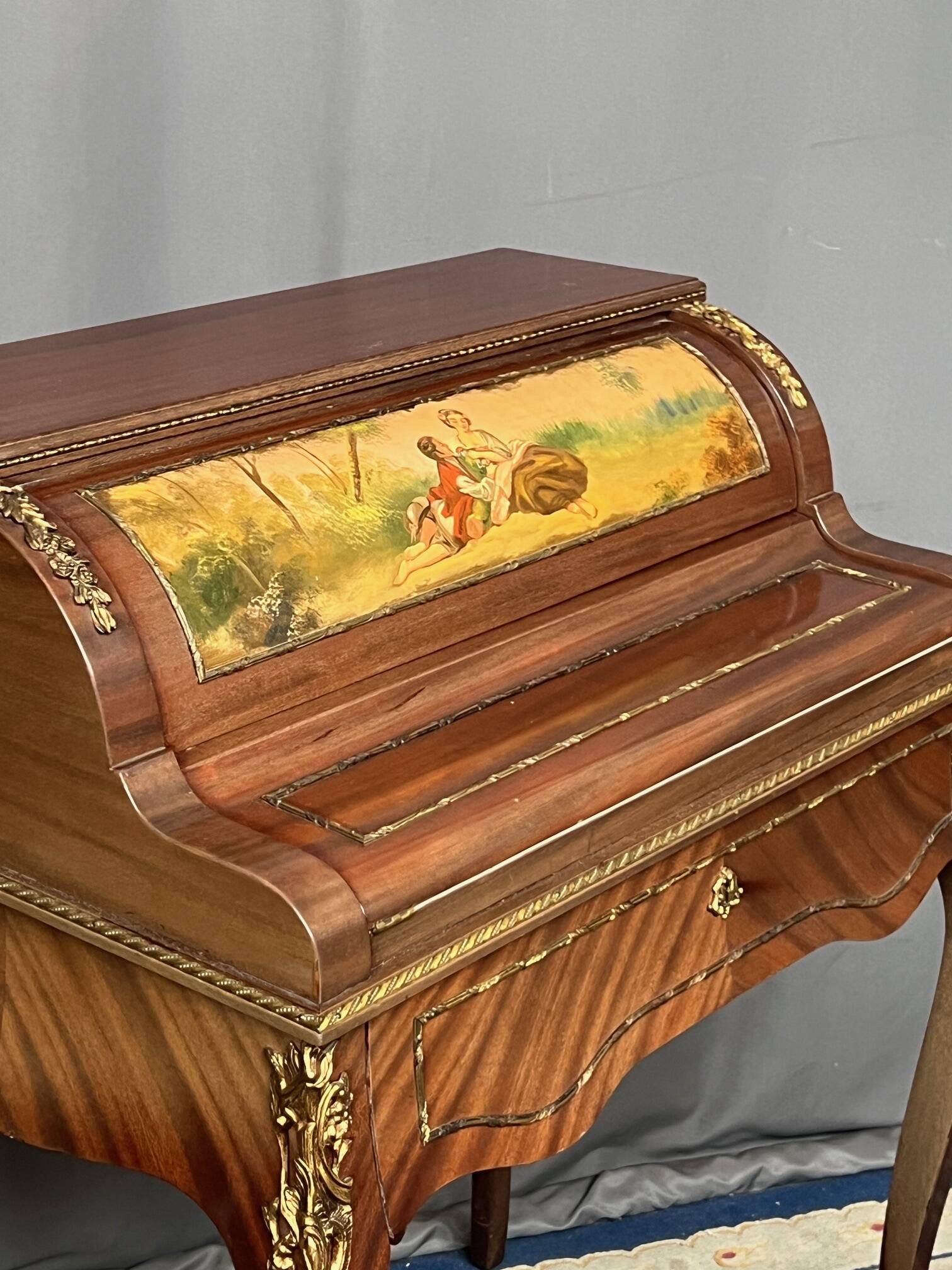 Louis XV style cylinder desk with gilded bronze mounts.