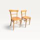 Pair of bistro chairs in light beech.