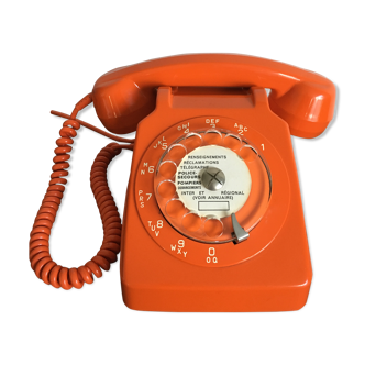 Vintage orange rotary phone