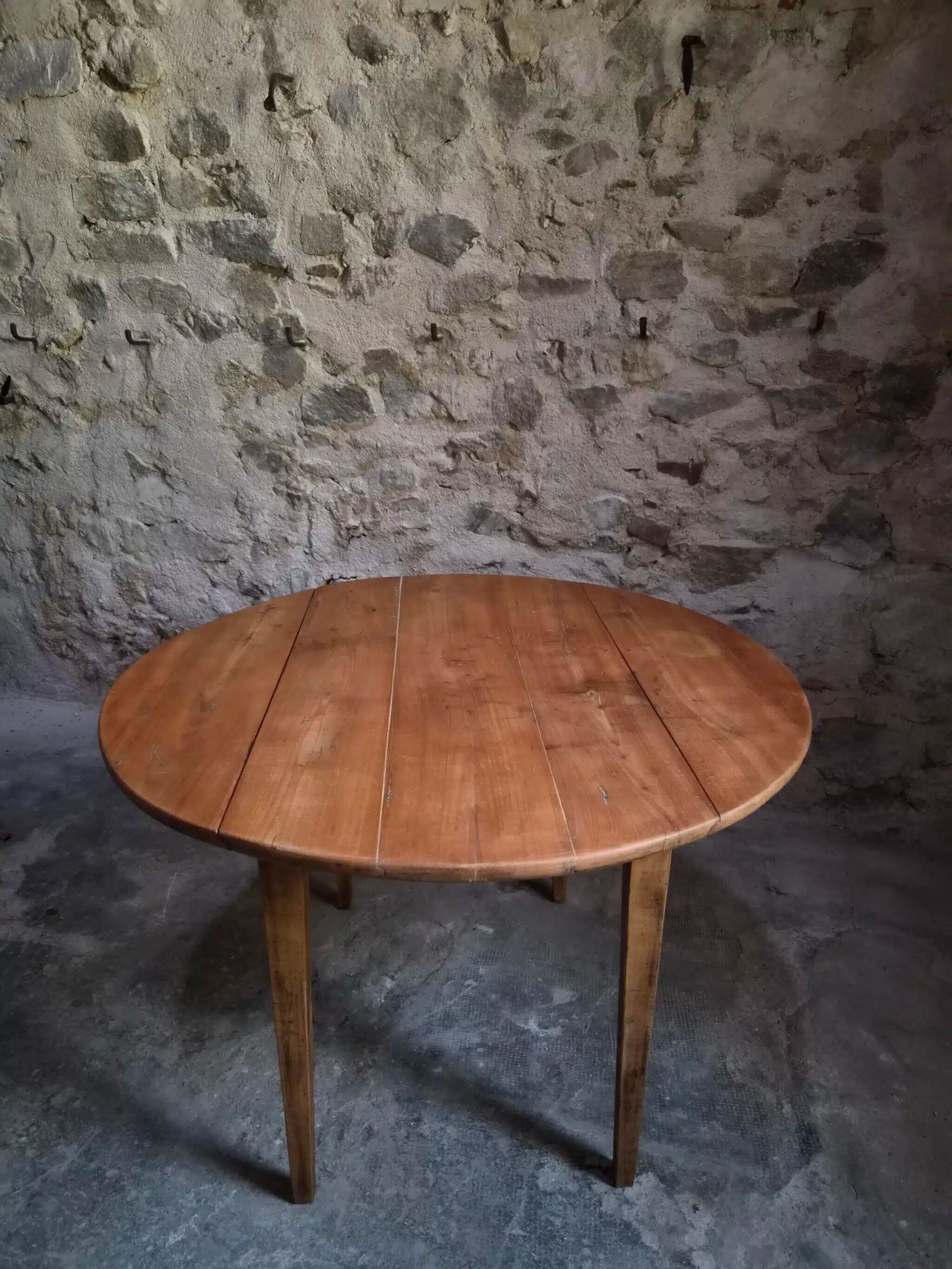 Rustic French antique dining table, drop-leaf table in cherry wood, circa 1900.