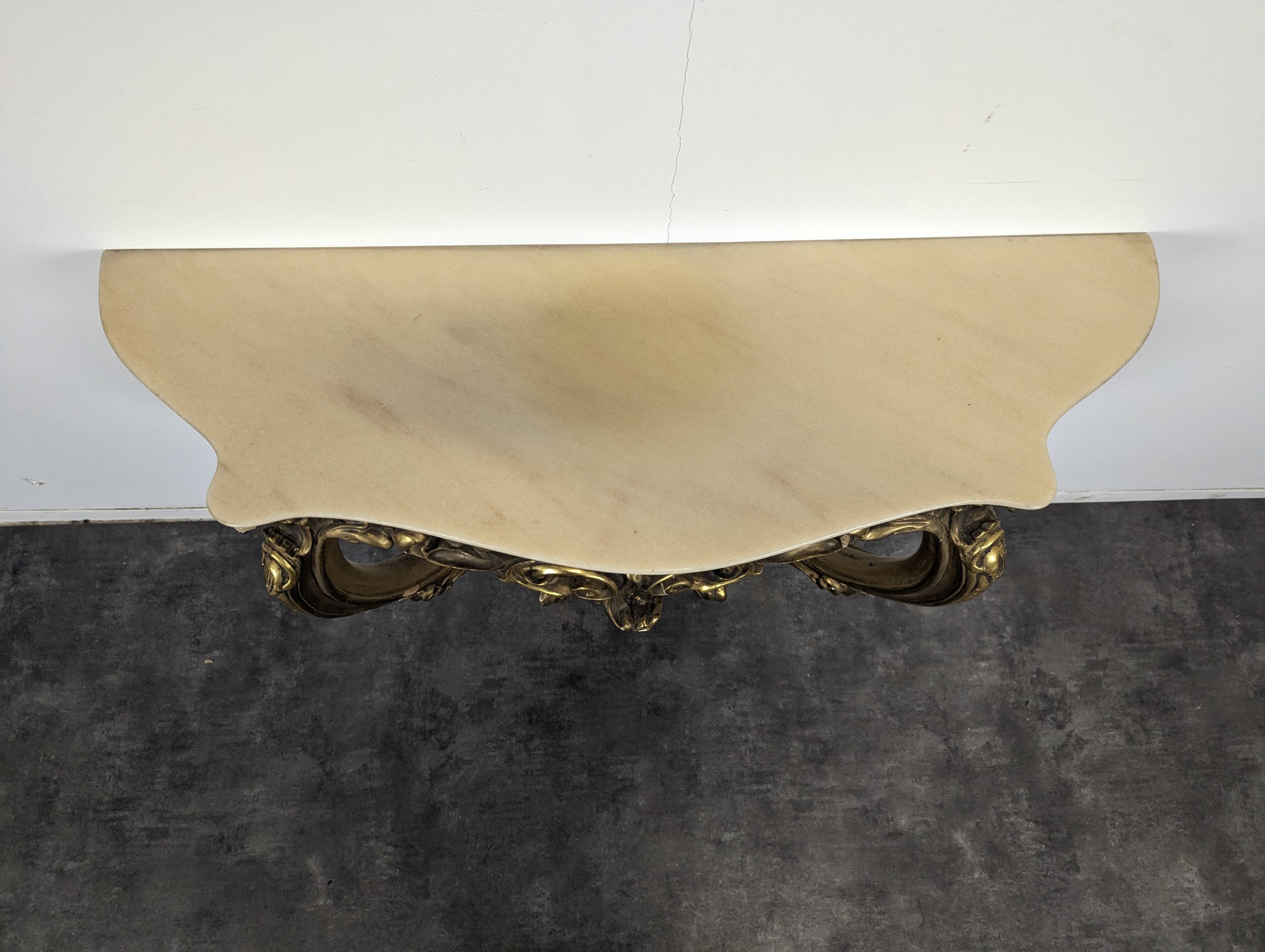 Golden wooden console in Louis XV style