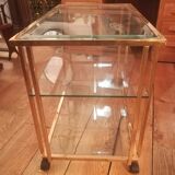 Trolley on wheels in gilded brass and beveled glass
