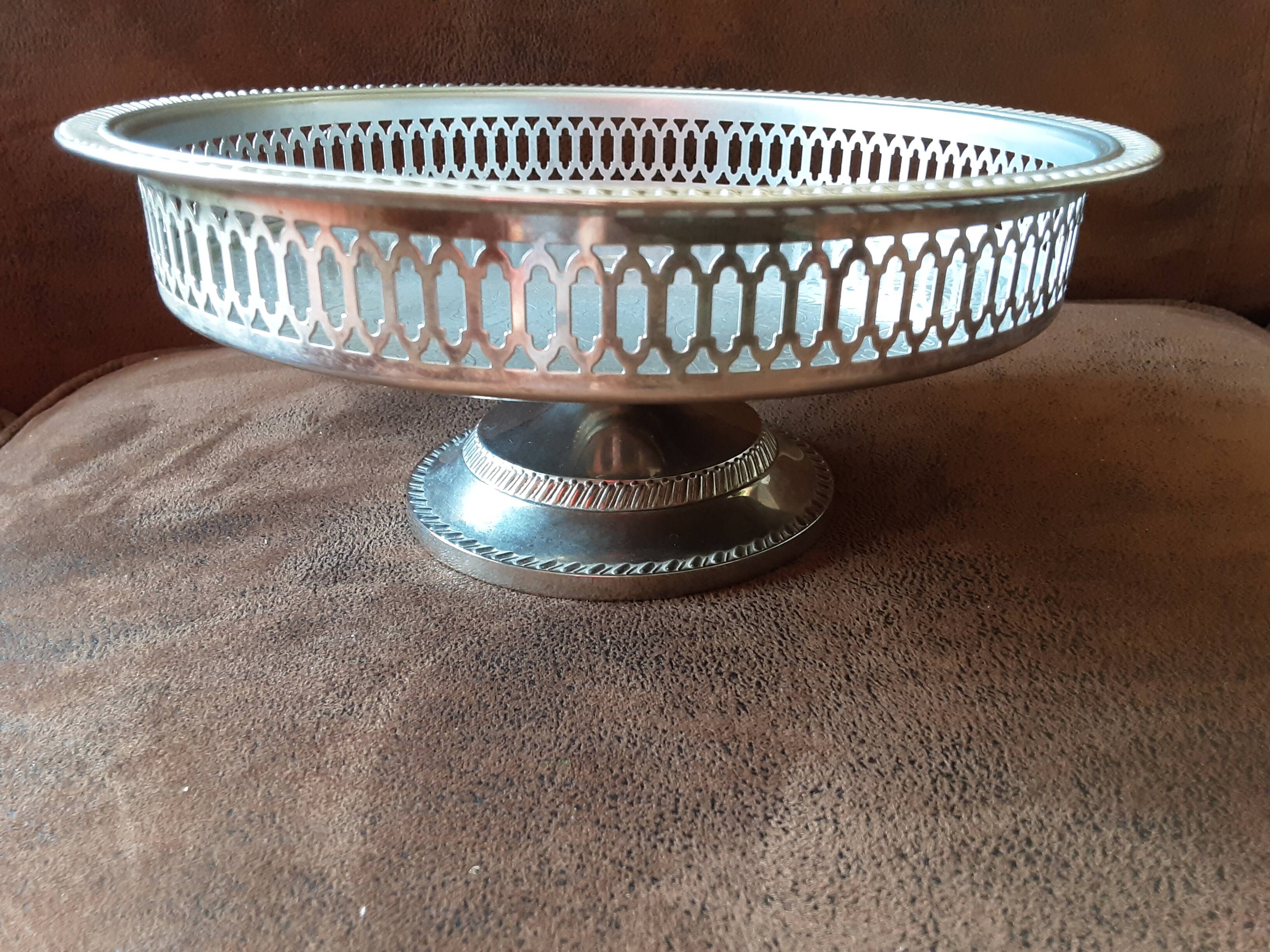 Old metal bowl on foot
